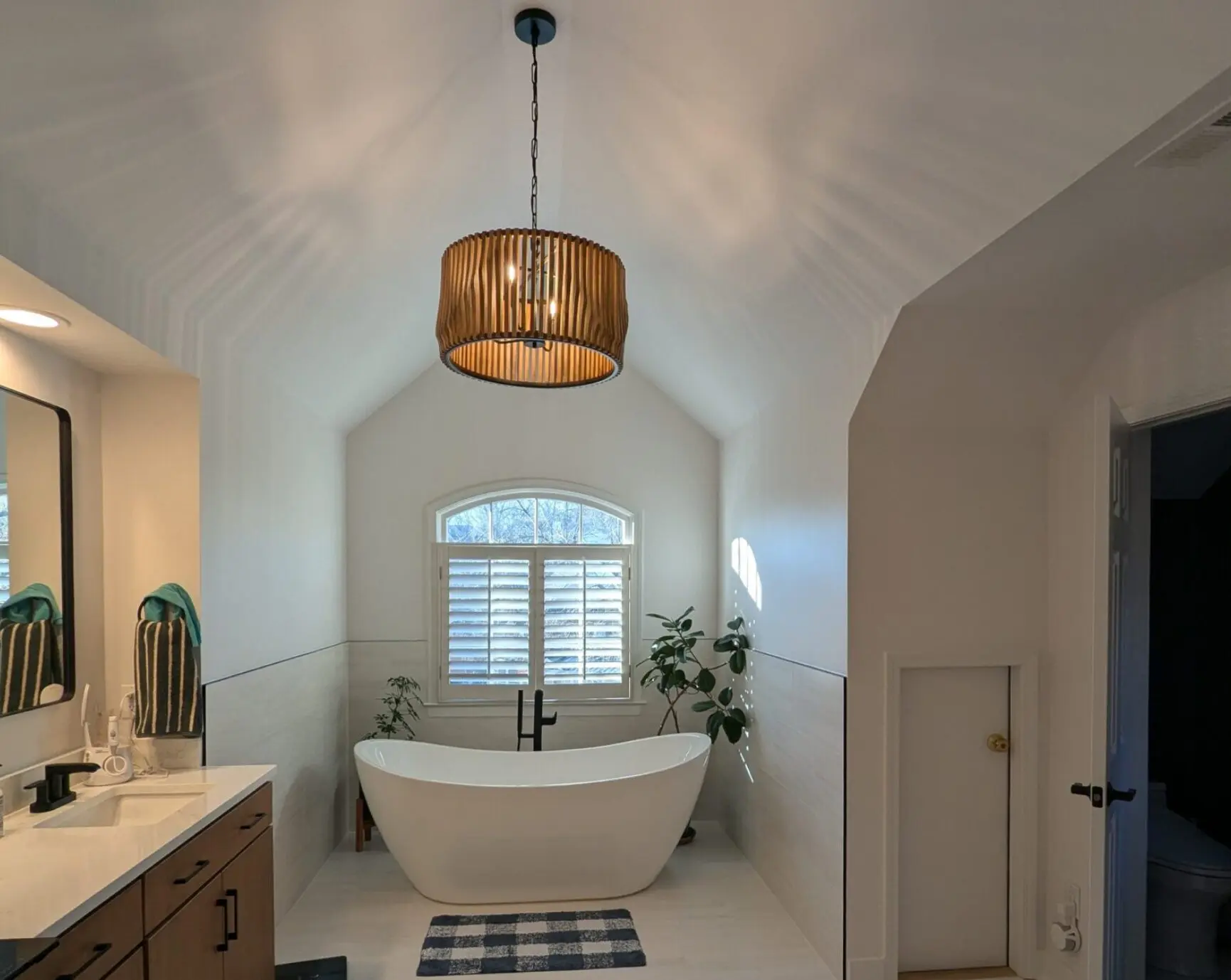 New Project (2) (1) A bathroom with a tub and sink in it
